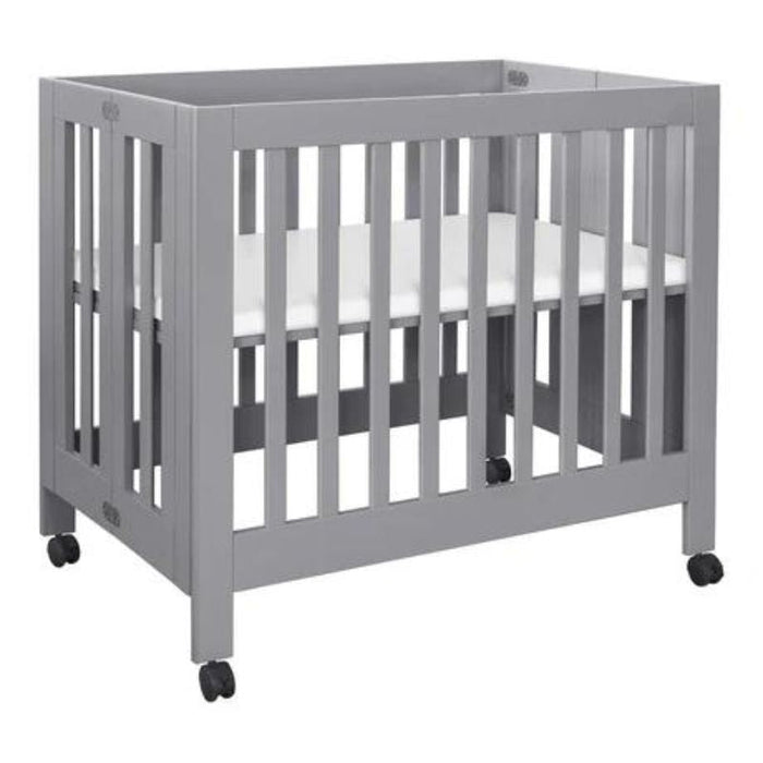 Grey mini crib on sale