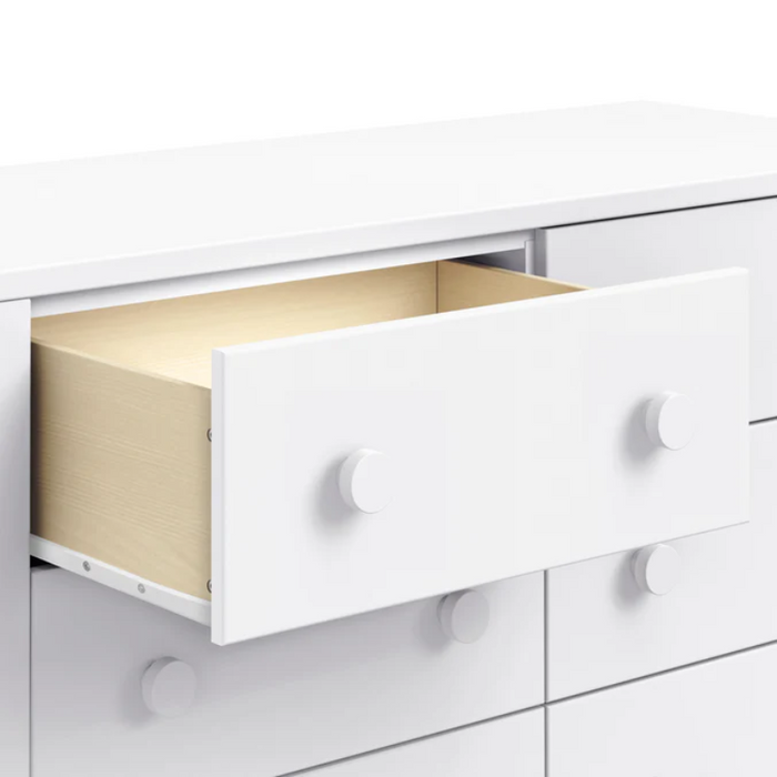 Sammy Scallop 6-Drawer Dresser by DaVinci at $549! Shop now at Nestled by Snuggle Bugz for Nursery & Décor.