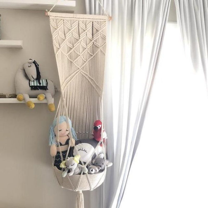 Macrame Hanging Toy Basket by Finn and Emma at $69.99! Shop now at Nestled by Snuggle Bugz for Nursery & Décor.