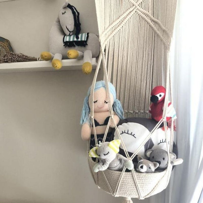 Macrame Hanging Toy Basket by Finn and Emma at $69.99! Shop now at Nestled by Snuggle Bugz for Nursery & Décor.