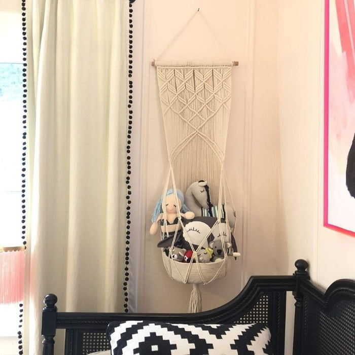 Macrame Hanging Toy Basket by Finn and Emma at $69.99! Shop now at Nestled by Snuggle Bugz for Nursery & Décor.
