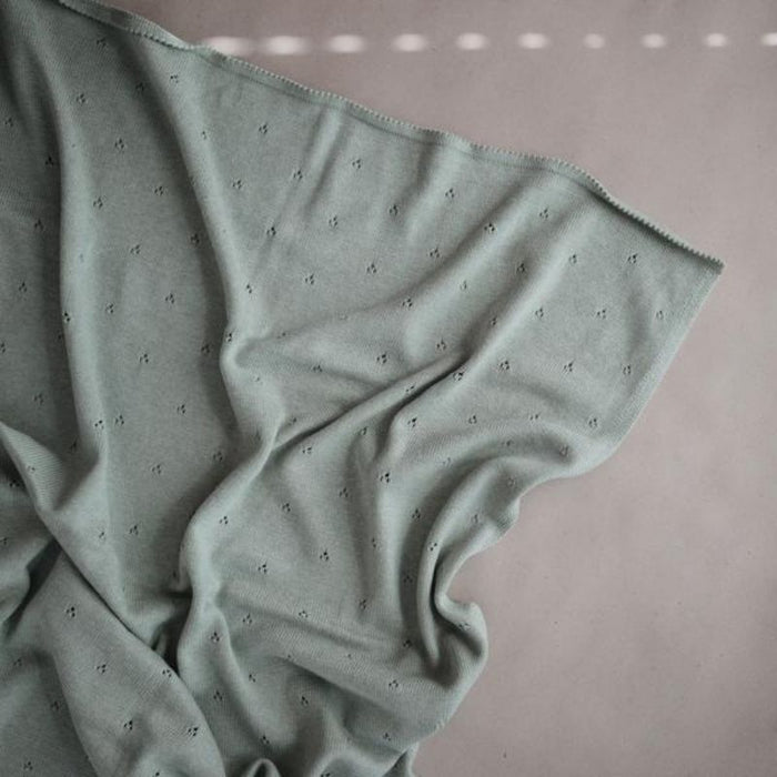 Knitted Pointelle Baby Blanket by Mushie at $60.99! Shop now at Nestled by Snuggle Bugz for Nursery & Décor.