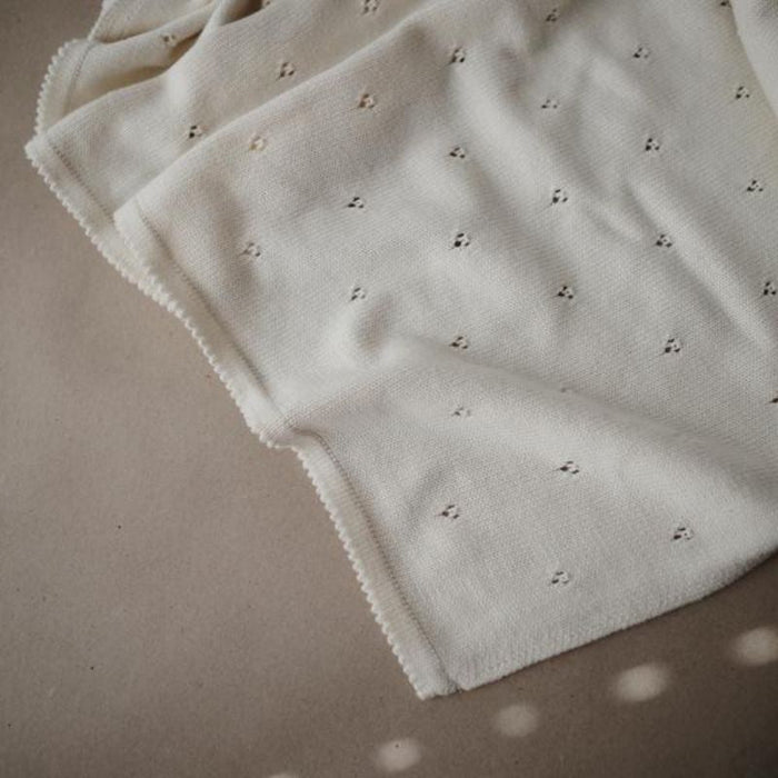 Knitted Pointelle Baby Blanket by Mushie at $60.99! Shop now at Nestled by Snuggle Bugz for Nursery & Décor.