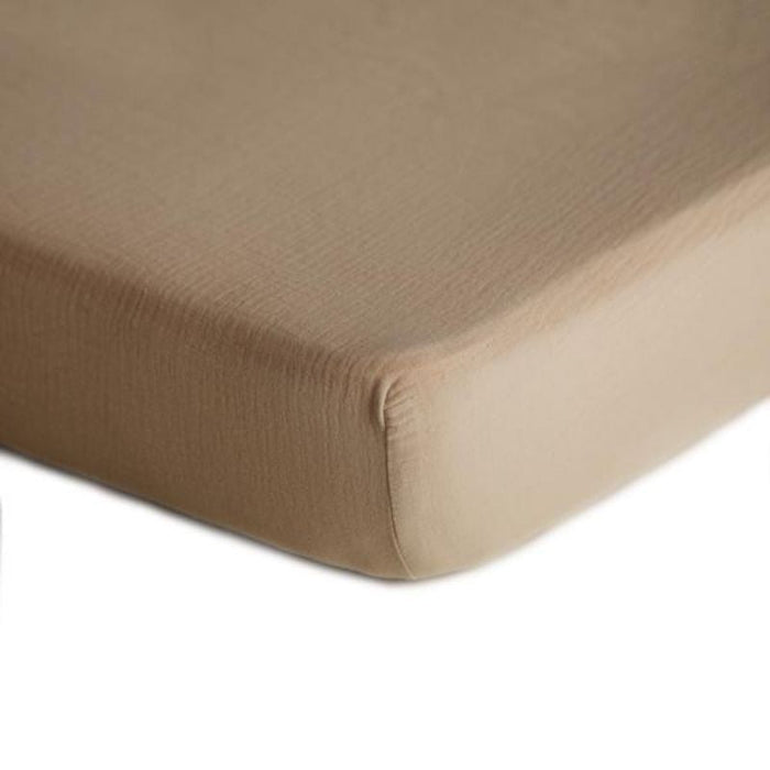 Extra Soft Muslin Crib Sheet by Mushie at $33.99! Shop now at Nestled by Snuggle Bugz for Nursery & Décor.