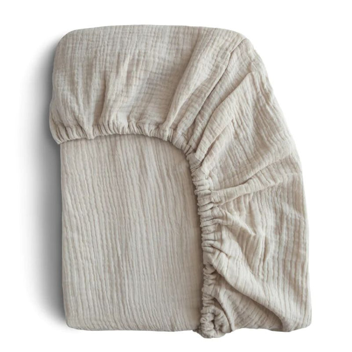 Mini Muslin Crib Sheet by Mushie at $23.99! Shop now at Nestled by Snuggle Bugz for Nursery & Décor.