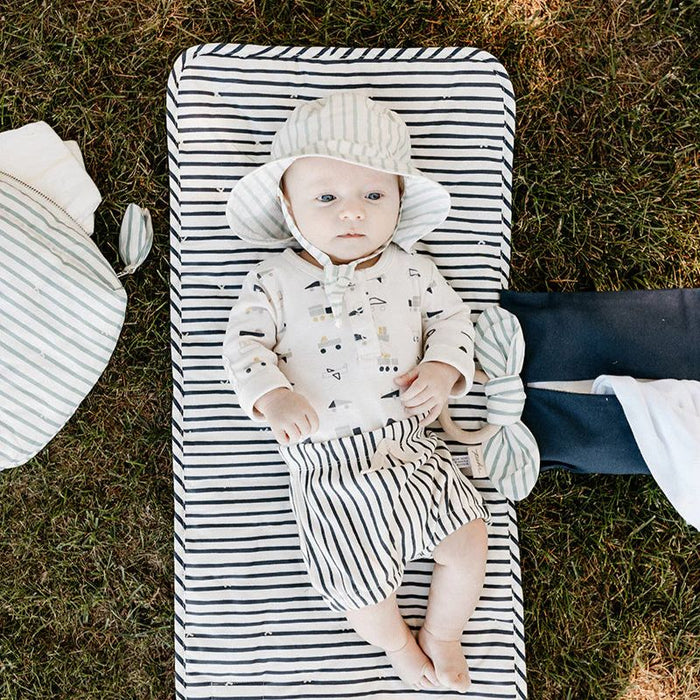 On the Go Portable Changing Pad by Pehr Designs at $57.99! Shop now at Nestled by Snuggle Bugz for Nursery & Décor.
