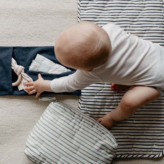On the Go Portable Changing Pad by Pehr Designs at $57.99! Shop now at Nestled by Snuggle Bugz for Nursery & Décor.