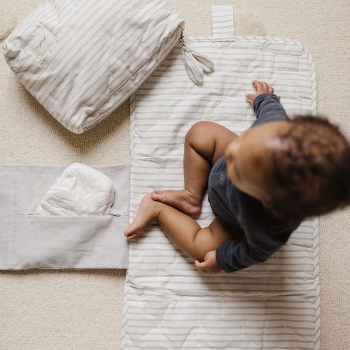 On the Go Portable Changing Pad by Pehr Designs at $57.99! Shop now at Nestled by Snuggle Bugz for Nursery & Décor.