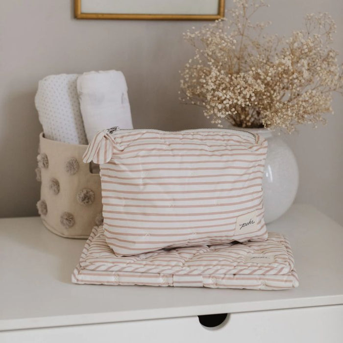 On the Go Portable Changing Pad by Pehr Designs at $57.99! Shop now at Nestled by Snuggle Bugz for Nursery & Décor.