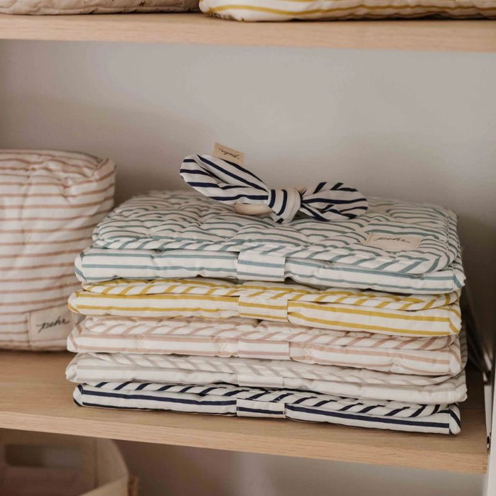 On the Go Portable Changing Pad by Pehr Designs at $57.99! Shop now at Nestled by Snuggle Bugz for Nursery & Décor.