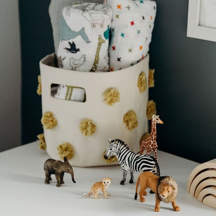 Pom Pom Basket - Mini by Pehr Designs at $29.99! Shop now at Nestled by Snuggle Bugz for Nursery & Décor.