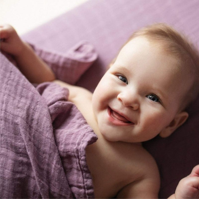 Organic Muslin Swaddle by Perlimpinpin at $10.39! Shop now at Nestled by Snuggle Bugz for Nursery & Decor.