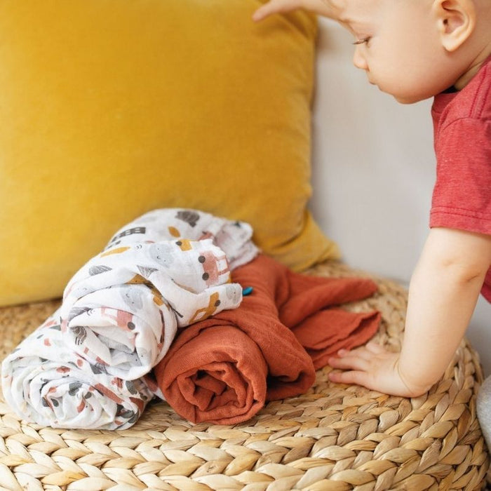 Organic Muslin Swaddle by Perlimpinpin at $10.39! Shop now at Nestled by Snuggle Bugz for Nursery & Decor.