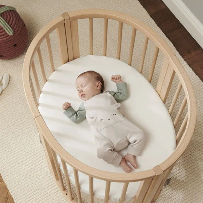 Sleepi Mini Protection Sheet V3 by Stokke at $67.99! Shop now at Nestled by Snuggle Bugz for Nursery & Décor.